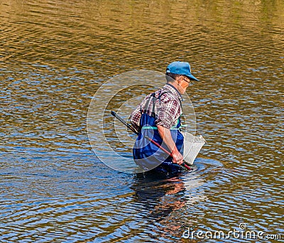 Man wearing blue waders in Kumgang river Editorial Stock Photo