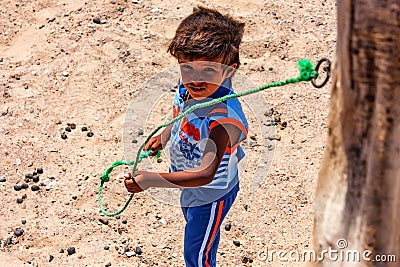 DAHAB, EGYPT - AUGUST 26, 2010: Young unidentified Bedouin boy in Egypt Editorial Stock Photo