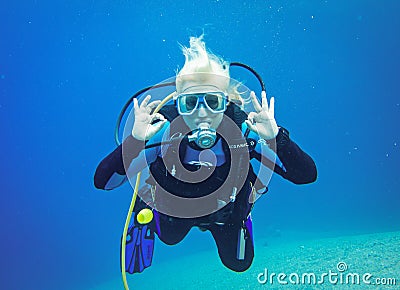 Dahab, Egypt - November 06, 2012. Scuba diver showing under water signal for okay Editorial Stock Photo