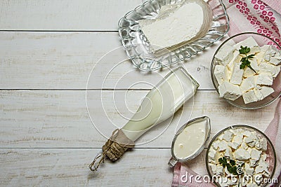 Dairy fresh produce on a wooden white background in a rustic style. Stock Photo