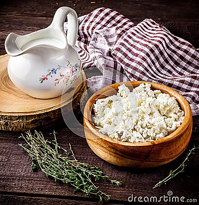 Dairy product, milk and cottage cheese on dark wooden table. Stock Photo