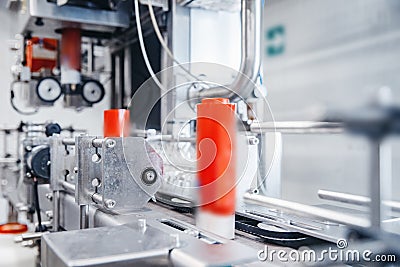 Dairy production, bottle of yoghurt on automated conveyor line, process of milk filling and packaging Stock Photo