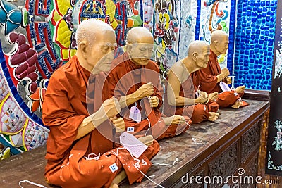DALAT, VIETNAM - APRIL 15, 2019: Group of statue of monks in pagoda in Dalat Vietnam Editorial Stock Photo