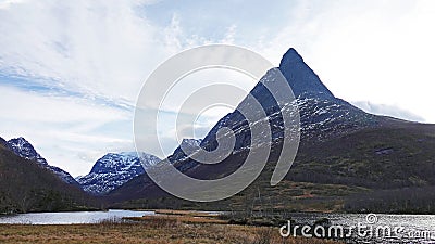 Dalatarnet peak in Innerdalen mountain valley in Norway in autumn Stock Photo
