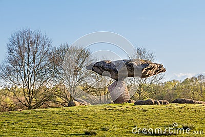 DALFSEN, NETHERLANDS, - May 01, 2015: Floating stone on a hill Editorial Stock Photo