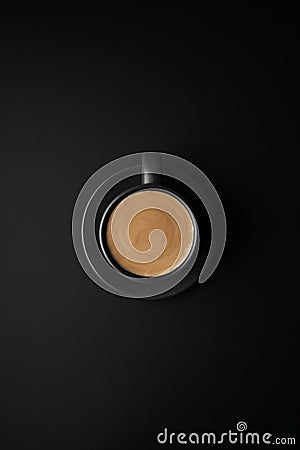 Dalgon coffee in black cup and saucer on a black surface Stock Photo