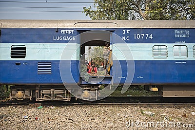 Dalit people traveling in the freight car. They are too poor to ever pay for a train ticket. They represent the lowest caste Editorial Stock Photo