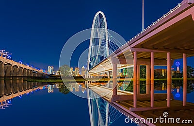 Dallas night lights reflect in water under bridge Editorial Stock Photo