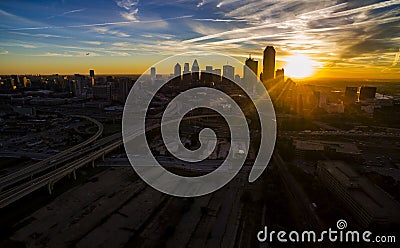 Dallas Texas Skyline Downtown Cityscape Sunrise sun rays over Urban Prawl massive City Stock Photo
