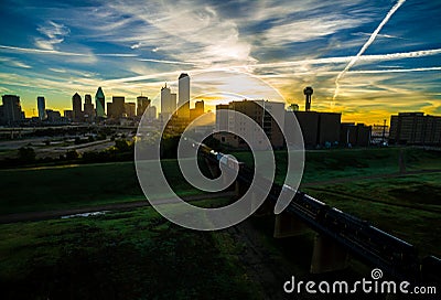 Dallas Texas Skyline Downtown Cityscape Sunrise sun rays over Urban Prawl massive City Stock Photo