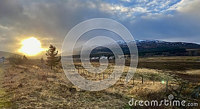 Dalwhinnie , Inverness, Scotland, from the A9. Mountains and clouds with Sun behind the clouds. Stock Photo