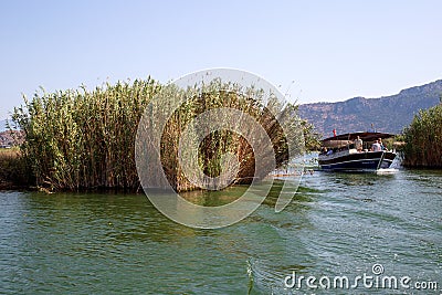 Scenic views of the Lycian rock tombs, and boat trips with tourists on the Dalyan River in Turkey. Editorial Stock Photo