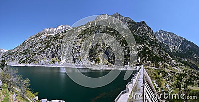 Dam of Cavallers Lake in Alta Ribagorca of Catalan Pyrenees Stock Photo