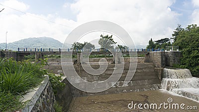 Dam divider river water flow. Editorial Stock Photo