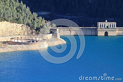 Dam and drain with blue bright water Stock Photo