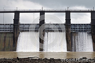 Dam with floodgate releases water Stock Photo