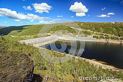 Dam at the lake Innerdalsvatnet, Norway Stock Photo