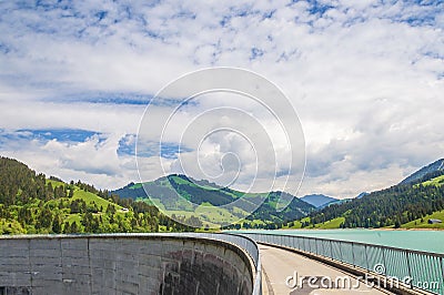 Dam in Longrin, Switzerland with a beautiful landscape in the background Stock Photo