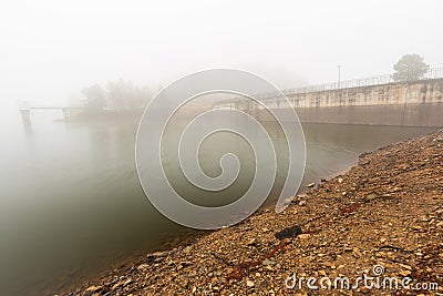 Dam on the Ponsul river, Penha Garcia, Portugal on a foggy day Stock Photo