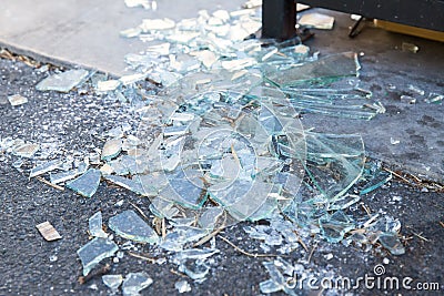 Shards of broken glass on floor Stock Photo