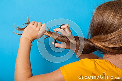 Damage problem hair concept. Brunette, scissors, haircut Stock Photo