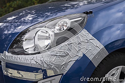 A damage to the car simply secured with armored tape Stock Photo