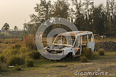 A damaged broken useless SUV car standing road side as a scrap Editorial Stock Photo