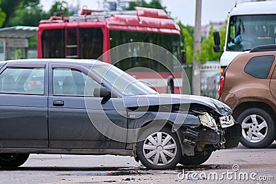 Damaged in car accident vehicle on city street crash site Stock Photo