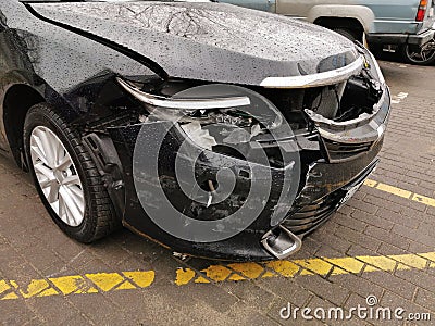 Damaged Car with Dents from the Accident, Car after an Head on Collision Stock Photo