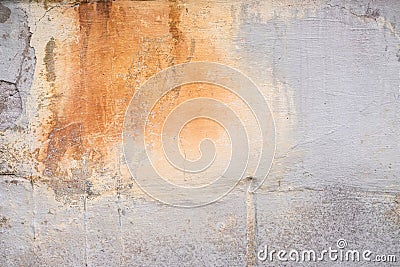 Damaged grey wall with orange paint splash texture background. Creative backdrop. Old building interior fragment Stock Photo