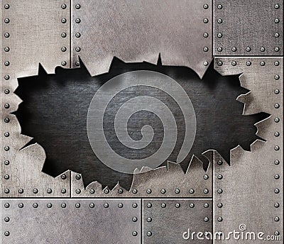 Damaged metal armor with torn hole background Stock Photo