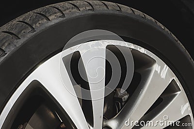 Damaged rim closeup. Car wheel on sunny day. Stock Photo