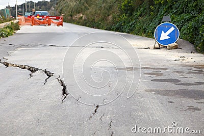 Damaged road with big cracks Stock Photo