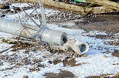 Damaged surveillance camera on the ground as a concept of failing policy of total surveillance. Vandalism act during riots. Stock Photo