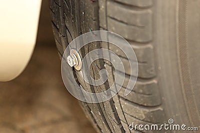 Damaged tire due to screw or nail in the tire Stock Photo