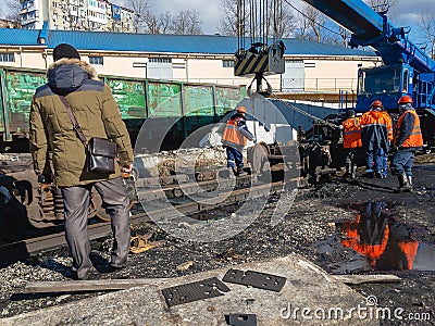 Railway workers liquidate the emergency. Editorial Stock Photo