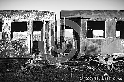 Damaged train wagons in an old abandoned railway network Stock Photo