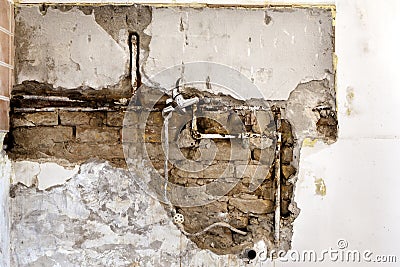 Damaged wall plumbing Stock Photo