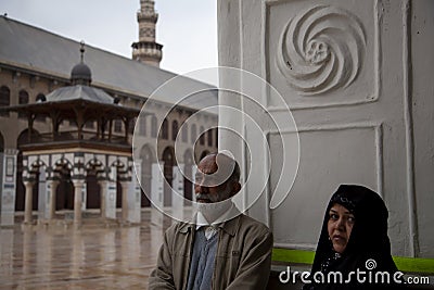A religious couple in front of a mosque Editorial Stock Photo