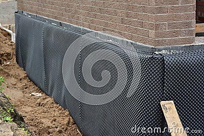 Damp proofing. House basement,foundation insulation details with waterproofing and Damp Proof membranes outdoors Stock Photo