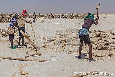 DANAKIL, ETHIOPIA - MARCH 24, 2019: Afar tribe salt miners in the Danakil depression, Ethiopi Editorial Stock Photo