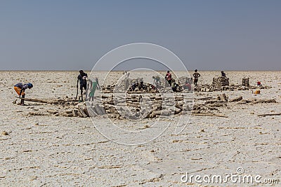 DANAKIL, ETHIOPIA - MARCH 24, 2019: Afar tribe salt miners in the Danakil depression, Ethiopi Editorial Stock Photo