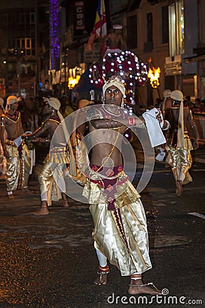 Dance of Beetle dancers perform along the streets of Kandy during the Esala Perahera in Sri Lanka. Editorial Stock Photo