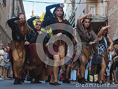 Dance Company dancing tribal dances. Improvised tribal dance in the street Editorial Stock Photo