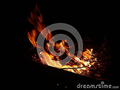 Dance of fire in the night. The flames are fanned by the wind Stock Photo