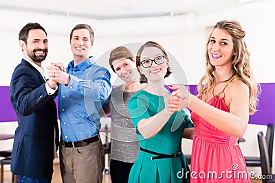 Dance instructor with gay couples in dancing class Stock Photo