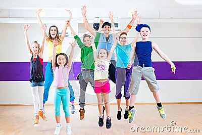 Dance teacher giving kids Zumba fitness class Stock Photo