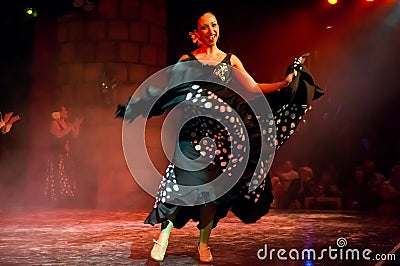 Dancer of the famous Spanish folk dance flamenco in the castle of San Miguel during a dance show for tourists Editorial Stock Photo