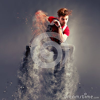Dancer jumping from explosion Stock Photo