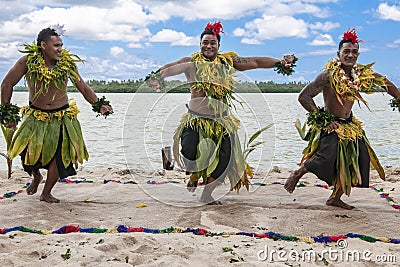 Dancers South Pacific. Young men dressed with typical dress made from nature dancing traditional dances in Tonga, Kingdom of Tonga Editorial Stock Photo